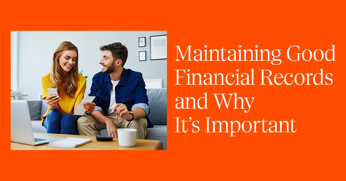 A man and woman sit together on a couch with a laptop, notebook, and a coffee cup on the table in front of them. The woman holds a smartphone while the man holds a credit card. Text on the right reads, "Maintaining Good Financial Records and Why It’s Important" on an orange background.